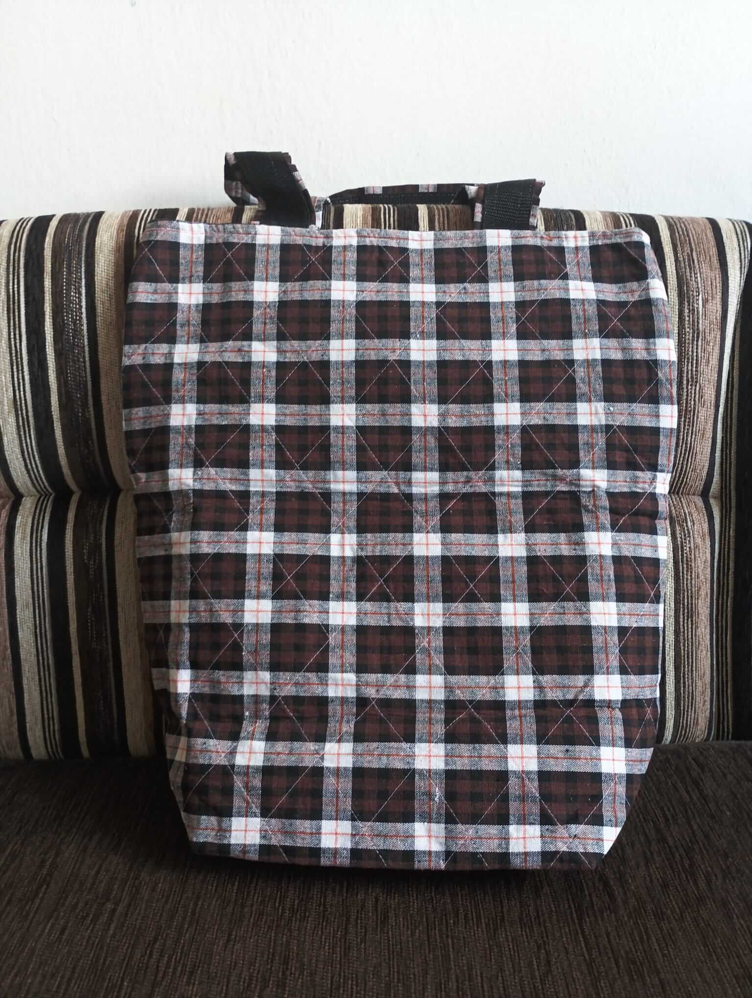 Stylish checkered bag with a black and brown pattern, perfect for everyday use.